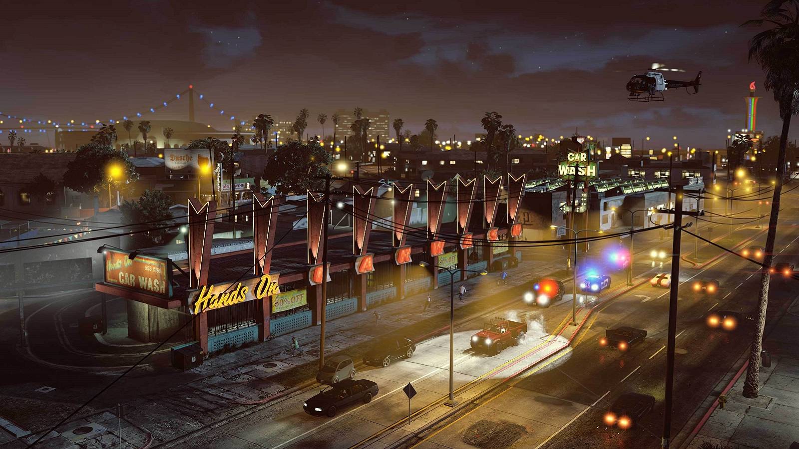 Screenshot from Grand Theft Auto 5 from high up showing the city at night.