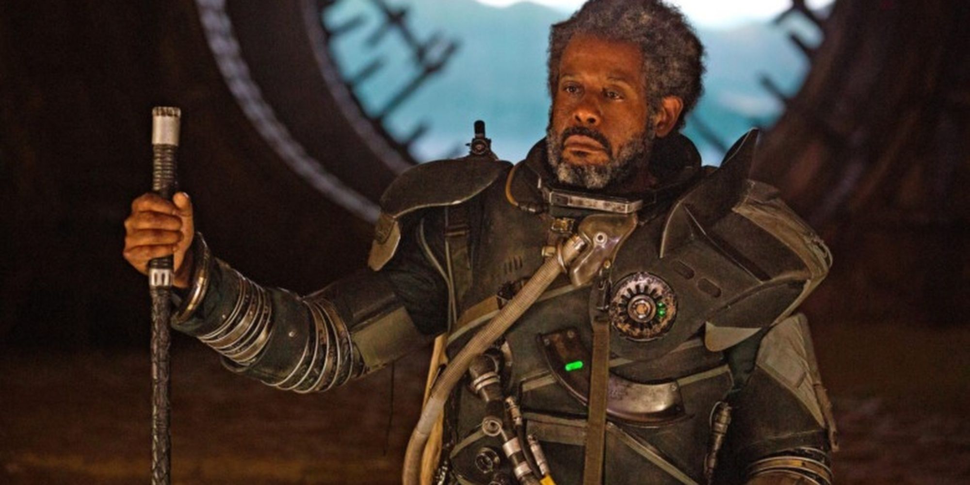 Star Wars Saw Gerrera standing with a staff