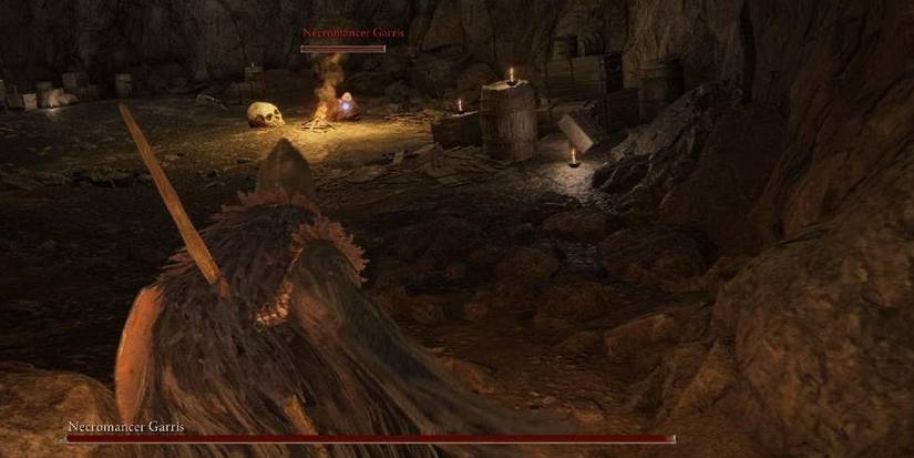 Player fighting Necromancer Garris in Elden Ring.