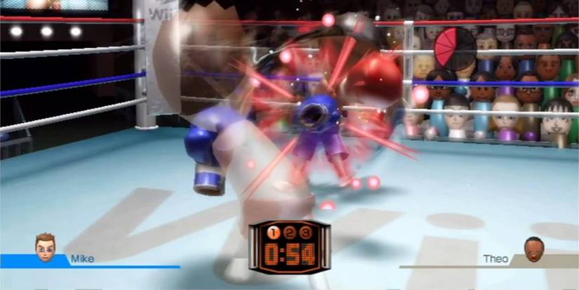 Gameplay of two Miis boxing taken from Wii Sports.