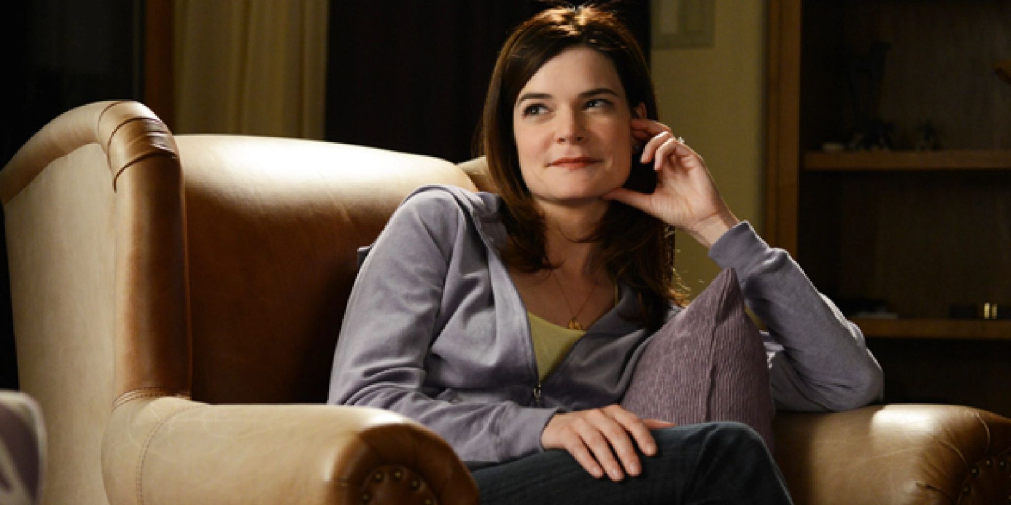 Marie sitting on a lounge chair in a hoodie in Breaking Bad