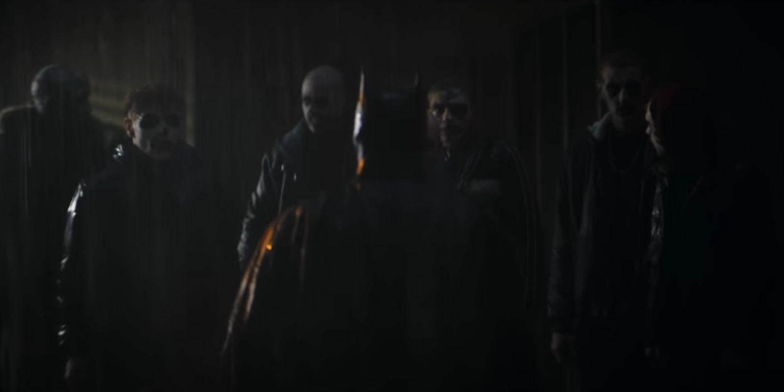 Batman confronts a gang in The Batman