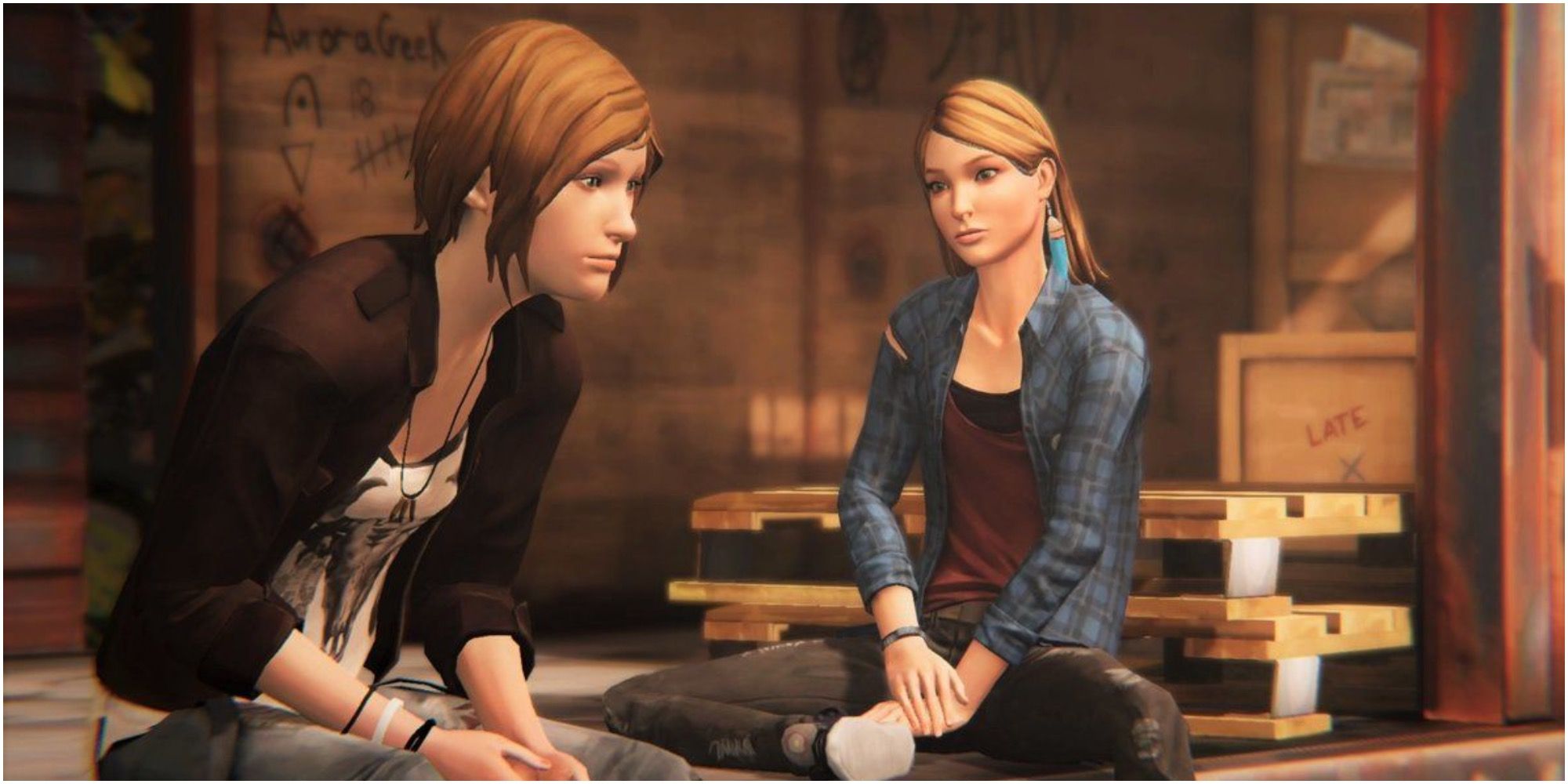 Chloe and Rachel sit together in an abandoned warehouse 