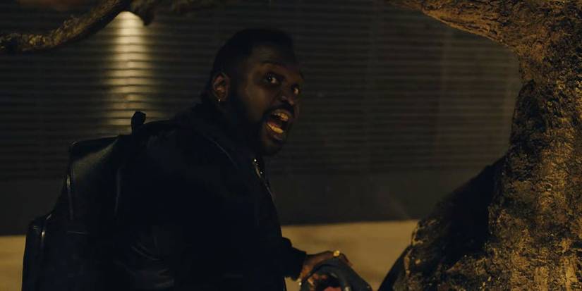 Brian Tyree Henry Al Paper Boi with a chainsaw 