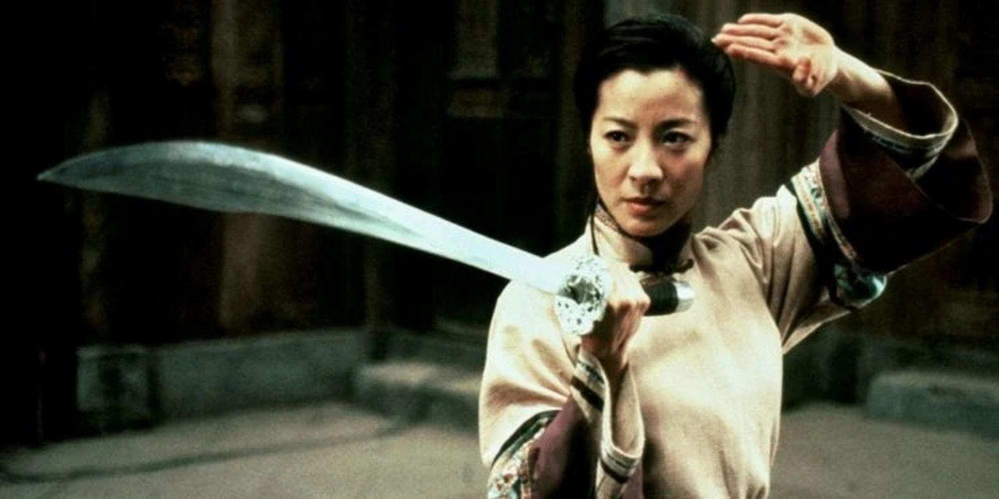 Michelle Yeoh with blade about to do battle 