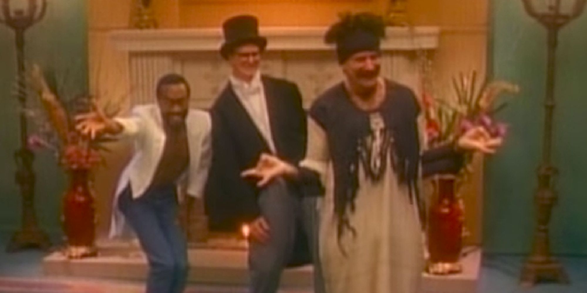 Bobby McFerrin, Bill Irwin, and Robin Williams dancing in the Don't Worry Be Happy video