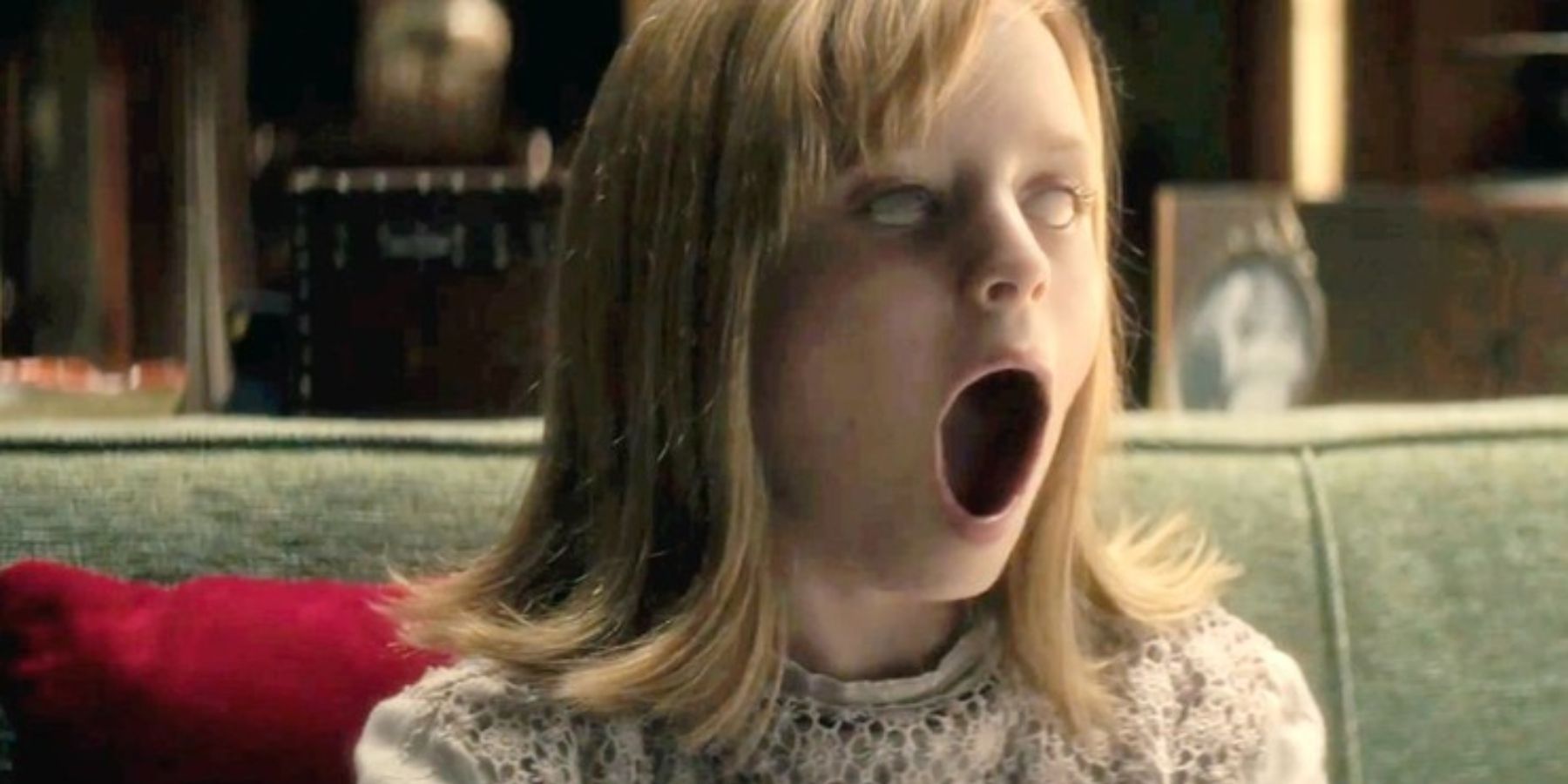 Doris (Lulu Wilson) opening up her mouth wide in Ouija: Origin Of Evil