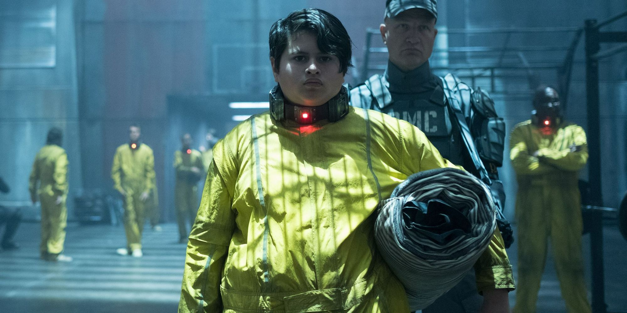 Firefist from Deadpool 2 in a prison jumpsuit and collar