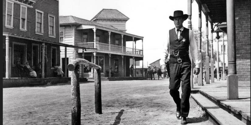 A lone figure walks in High Noon