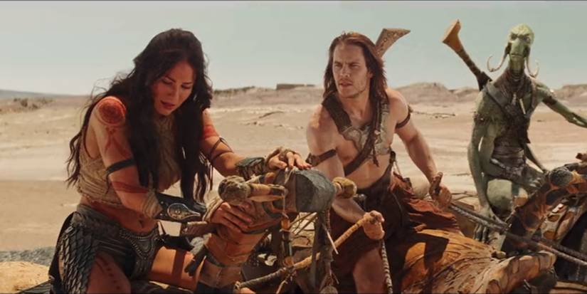 Dejah Thoris, John Carter, and Tars Tarkas ride across the Martian desert in John Carter
