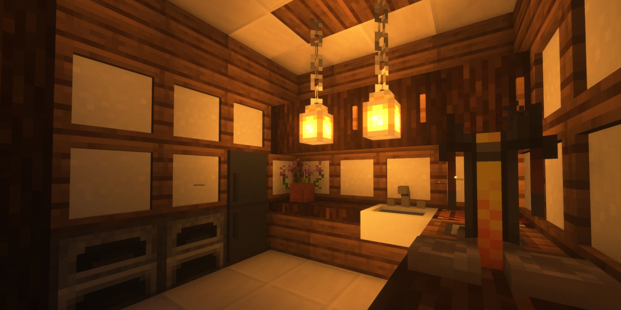 A kitchen in Minecraft lit by lanterns on chains