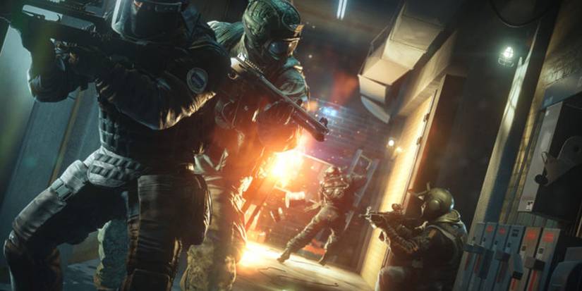 Rainbow Six Siege Operators surveying the environment during a firefight