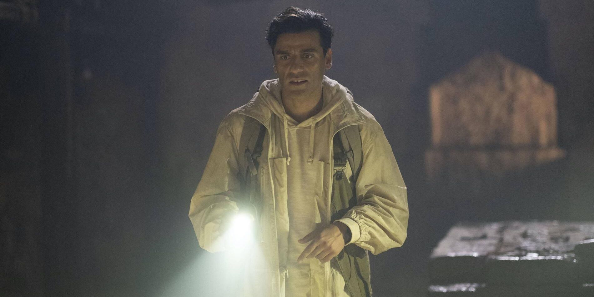 Oscar Isaac with a flashlight in Moon Knight