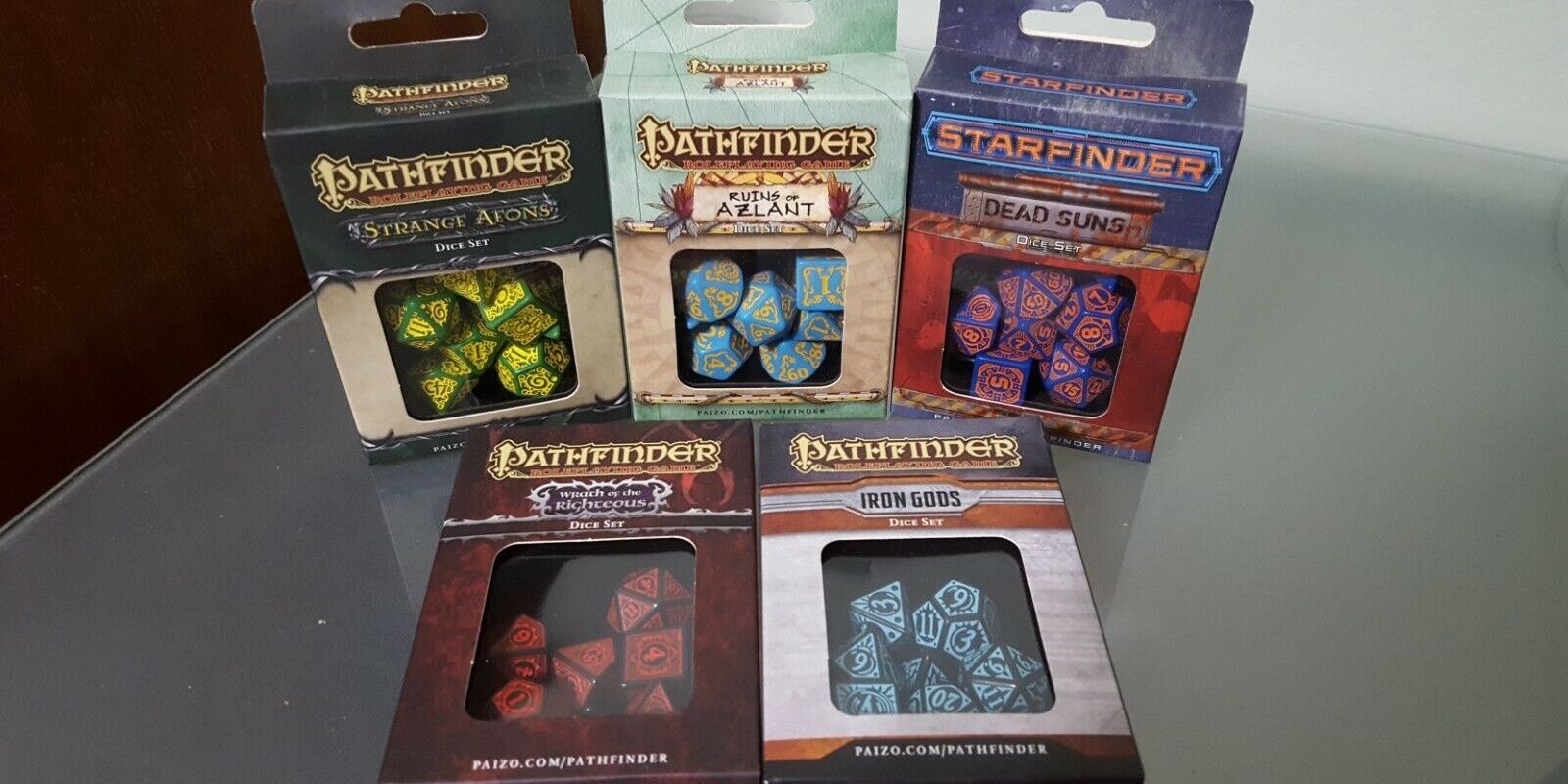 Pathfinder Dice Set including strange eons, dead suns, ruins of azlant, iron gods, and wrath of the rigetous