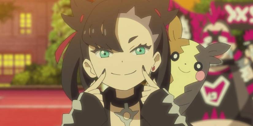 Marnie smiling next to her Morpeko in front of Team Yell grunts
