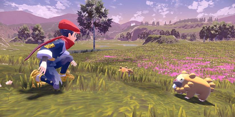 Pokemon-Legends-Arceus-trainer-with-pokemon-in-field