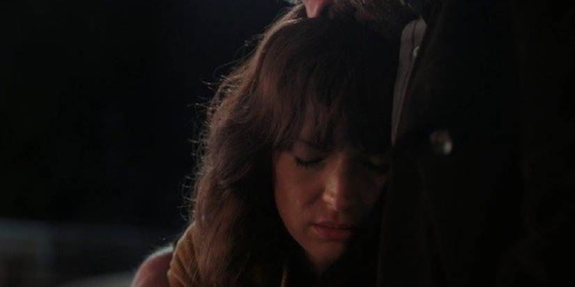 Joyce resting her head on Hopper at the end of season 2