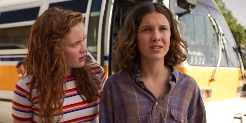 Max and Eleven getting off a bus