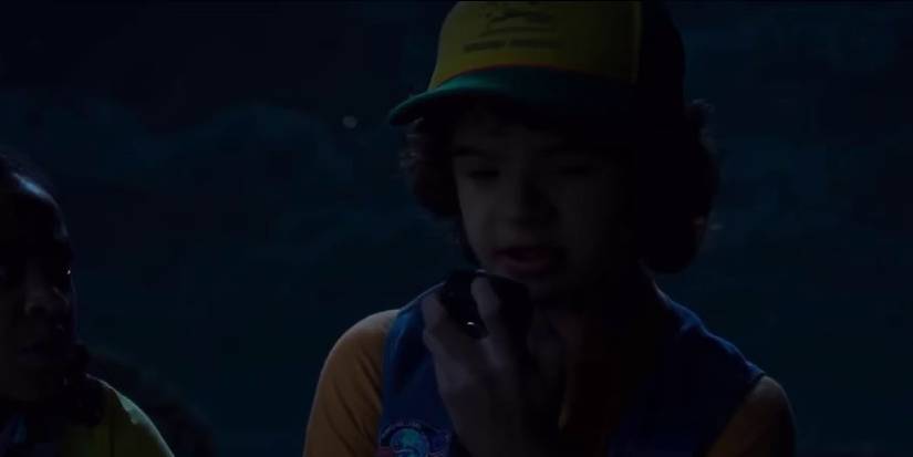 Erica watching Dustin sing to Suzie from his radio