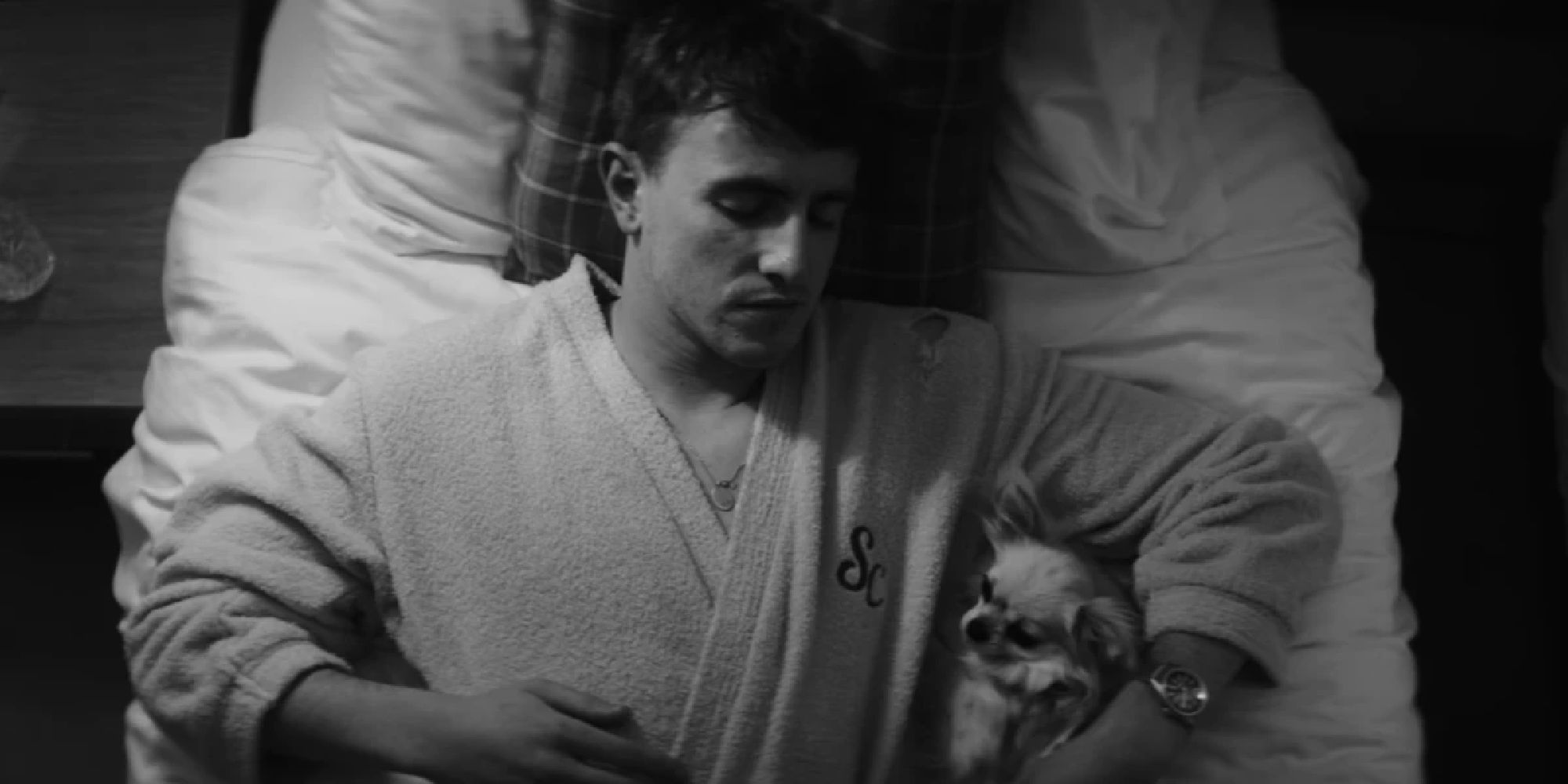 Paul Mescal in a bed with a dog in the Savior Complex video