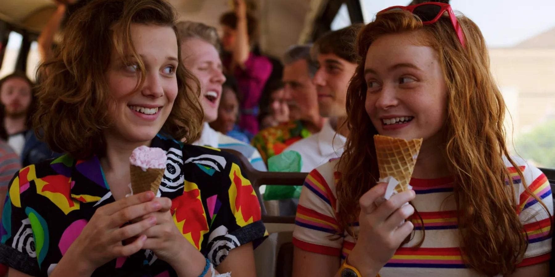 Eleven (Millie Bobby Brown) and Max (Sadie Sink) holding ice cream cones in Stranger Things
