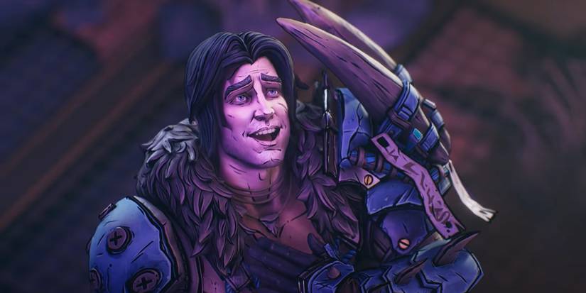 a brown-haired man with a big, goofy smile dressed in a coat with a fur collar and a large pair of monster claws strapped to one shoulder