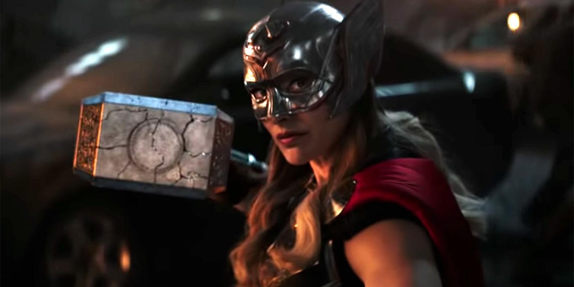 Natalie Portman as Jane Foster dressed as Thor and wielding Mjolnir in battle