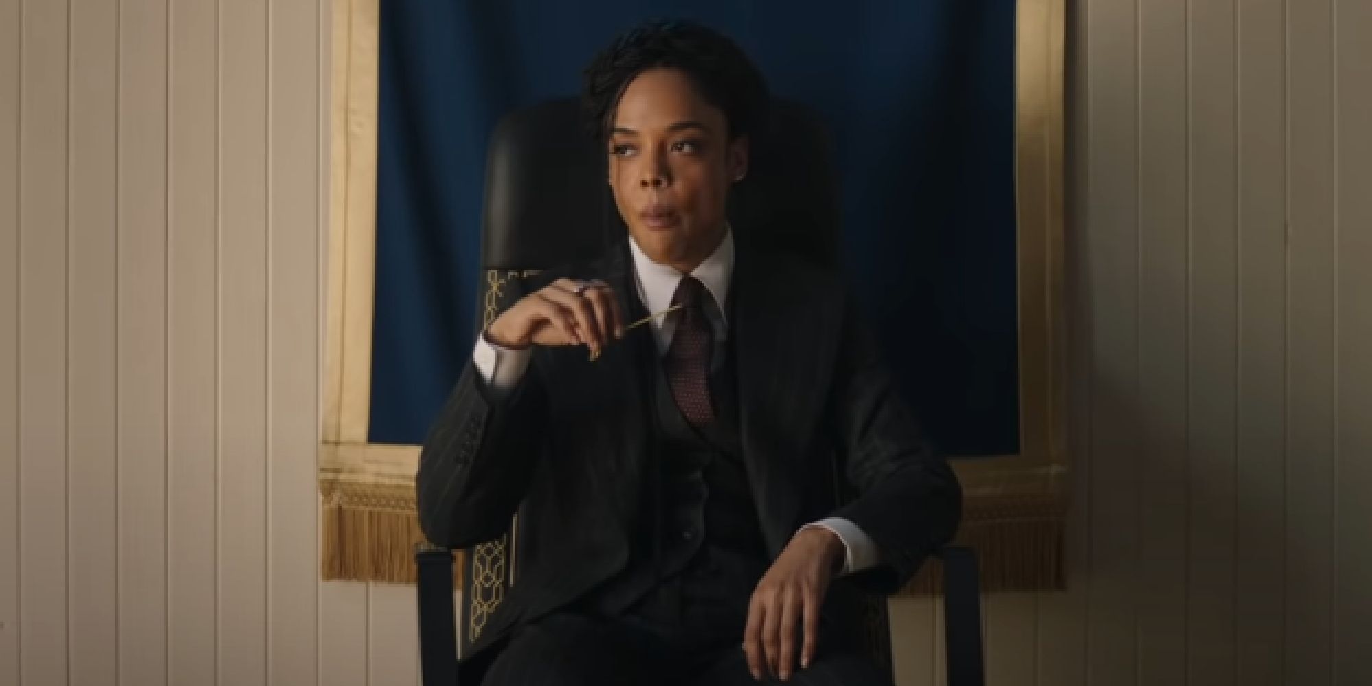 Valkyrie sitting in a chair in New Asgard from the Thor Love & Thunder trailer