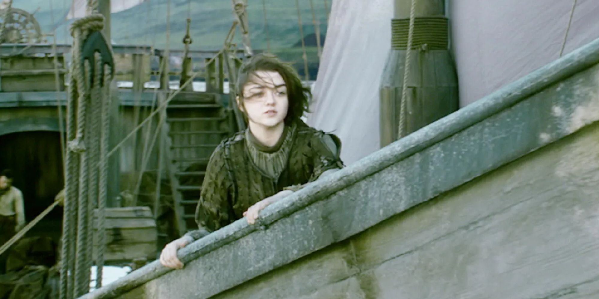 Arya Stark standing at the bow of a ship at the end of Season 4