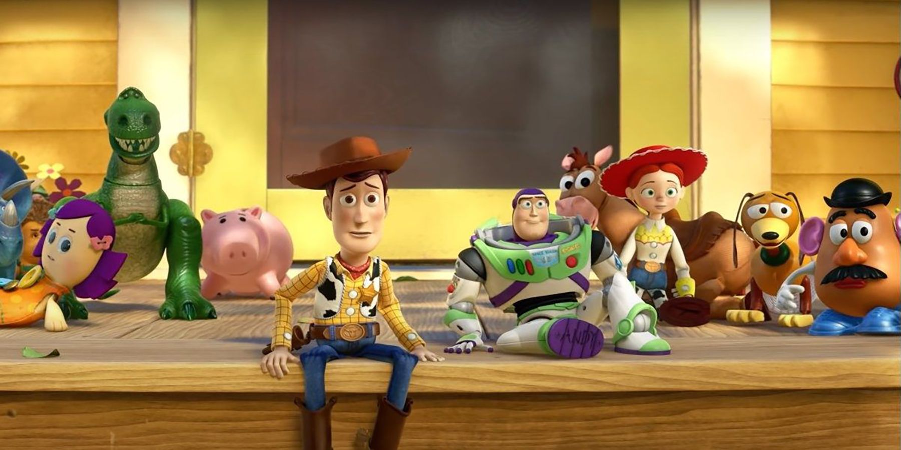 The ending scene from the movie "Toy Story 3", with all of Andy's toys sitting on the porch.