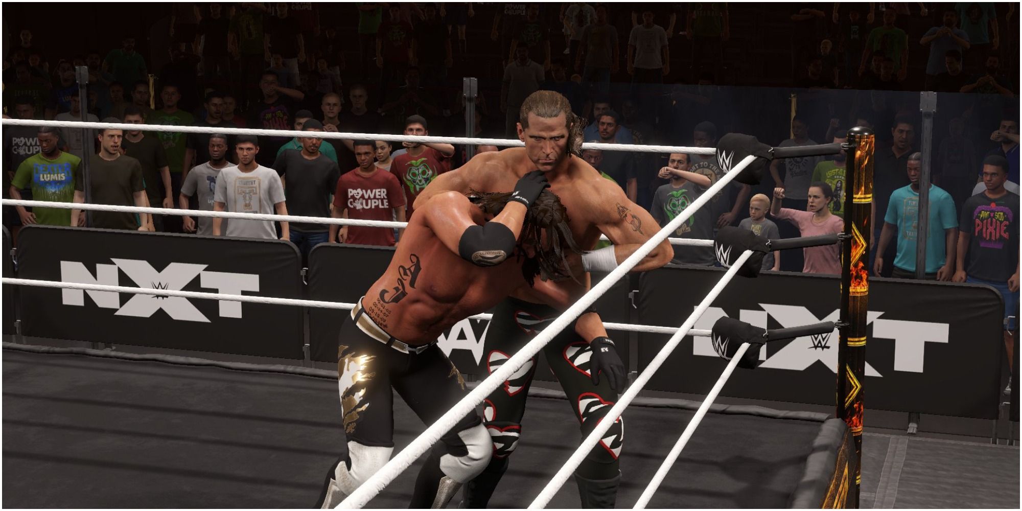 WWE 2K22 Shawn Michaels dragging AJ Styles to the ropes