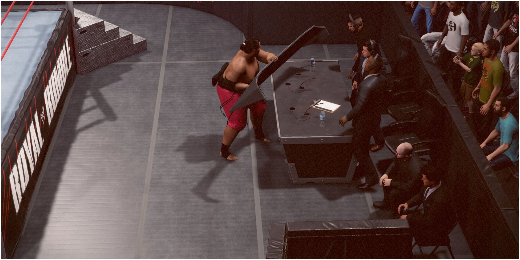 WWE 2K22 Yokozuna clears the table for the slam