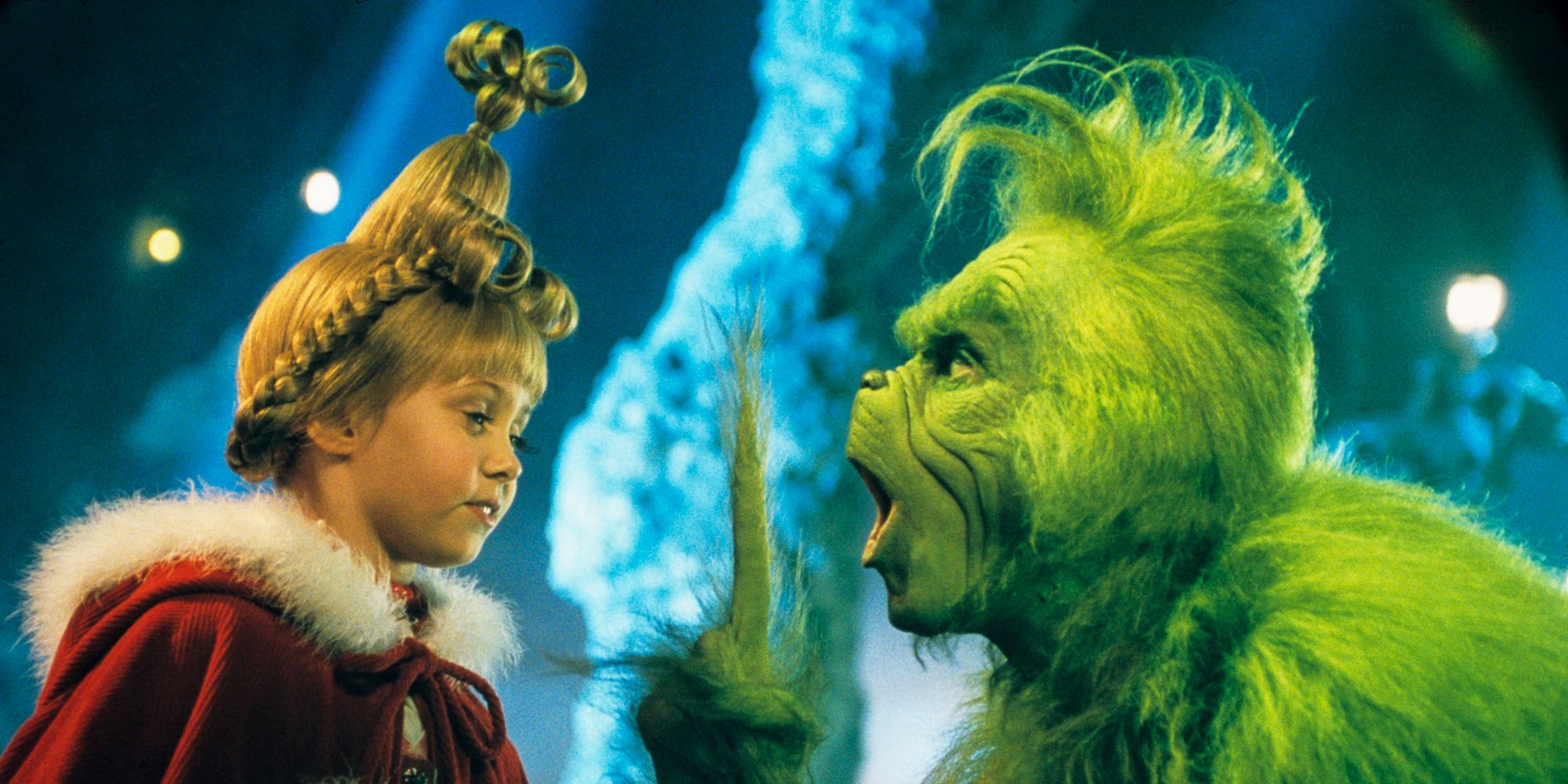 The Grinch scolds Cindy Lou Who after she enters his home