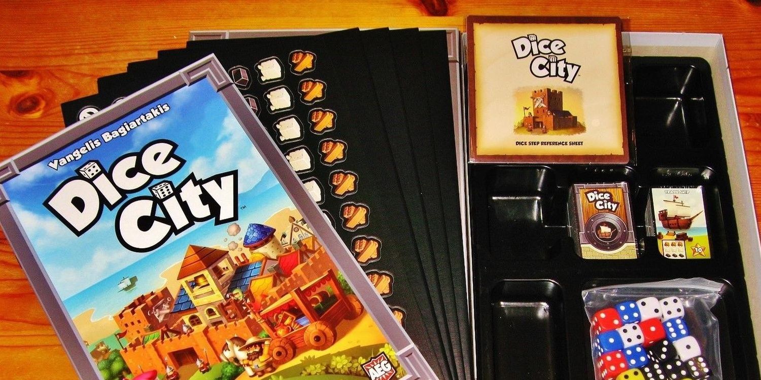 dice city game showing rulebook and components