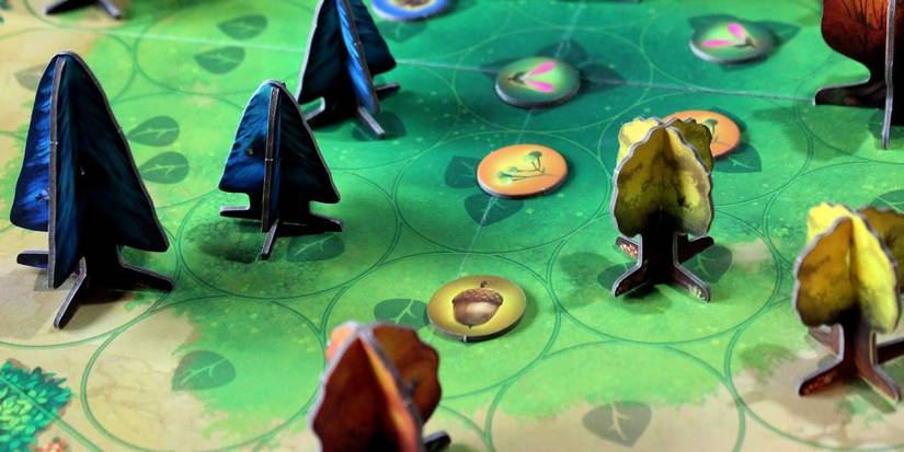 photosynthesis game showing lush board and tree components