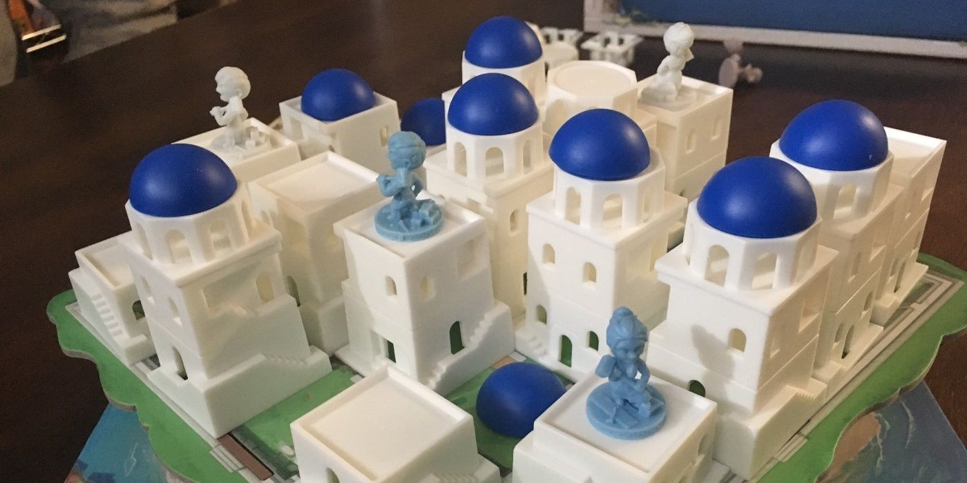 santorini game showing iconic components and worker meeples