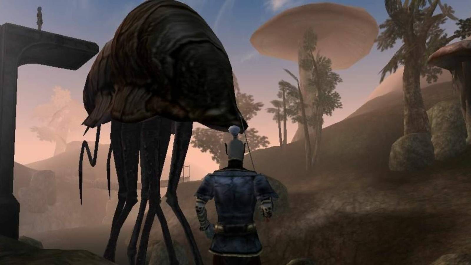 Image from Morrowind showing a Dark Elf stood next to a Silt Strider.