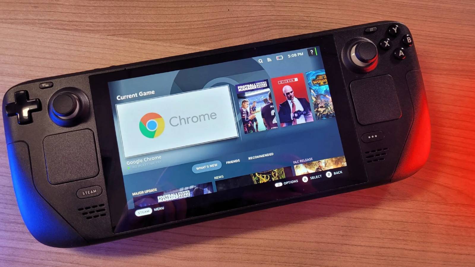 A photo of a Steam Deck on a wooden table.