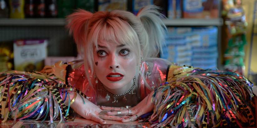 A distressed Harley Quinn waiting a deli counter in Birds of Prey
