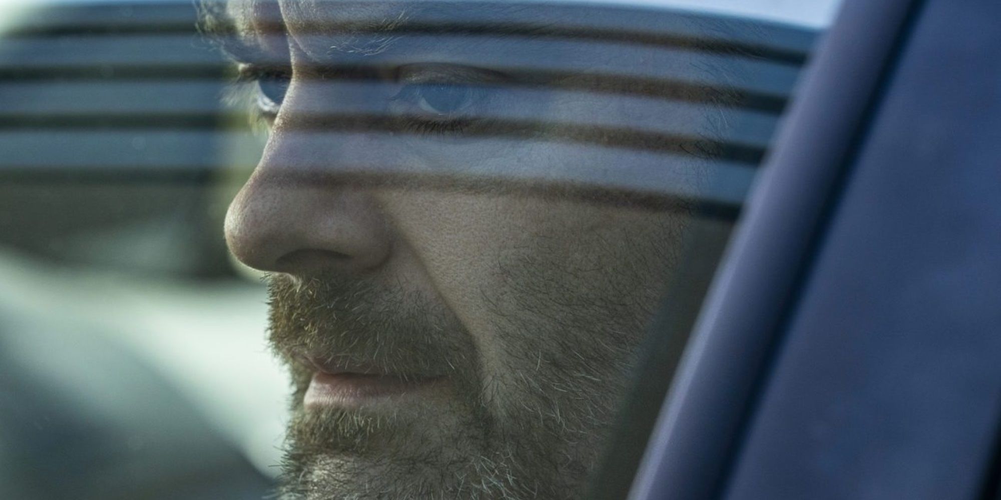 Bill Hader sits in a car in Barry