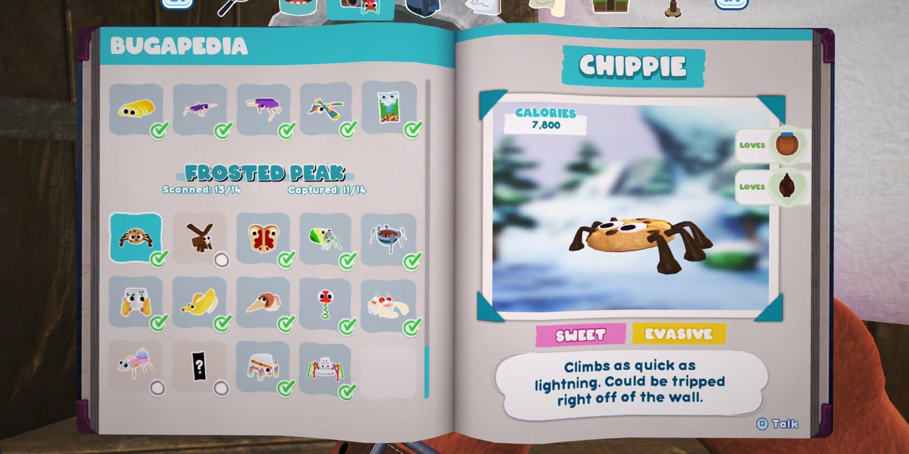 an open notebook with a list of bugsnax on the left page and a chocolate chip cookie with googly eyes and spider legs on the right page