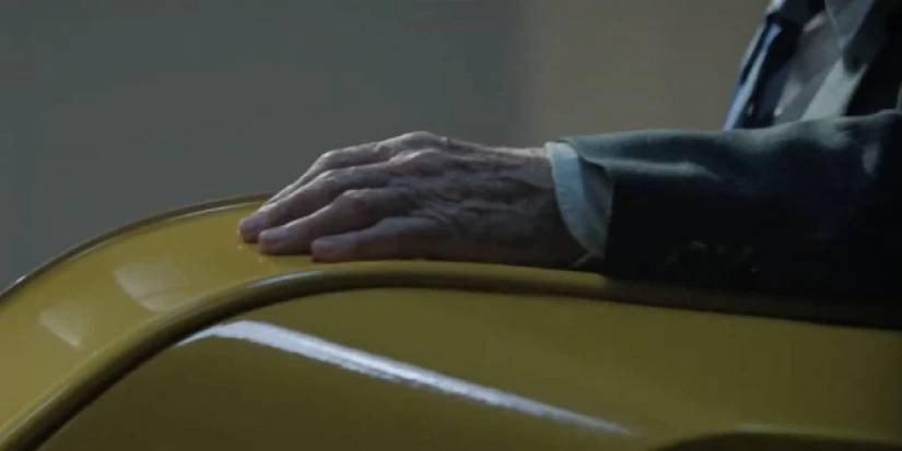 Charles Xavier's hand resting on his yellow wheelchair in Multiverse of Madness