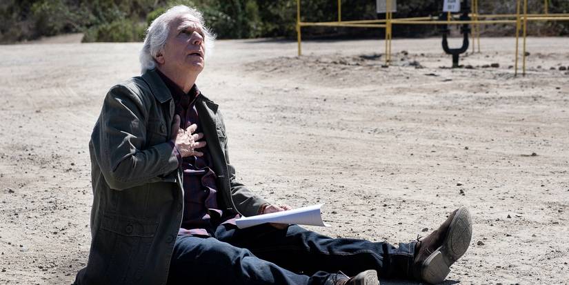 Gene sits on the ground in Barry