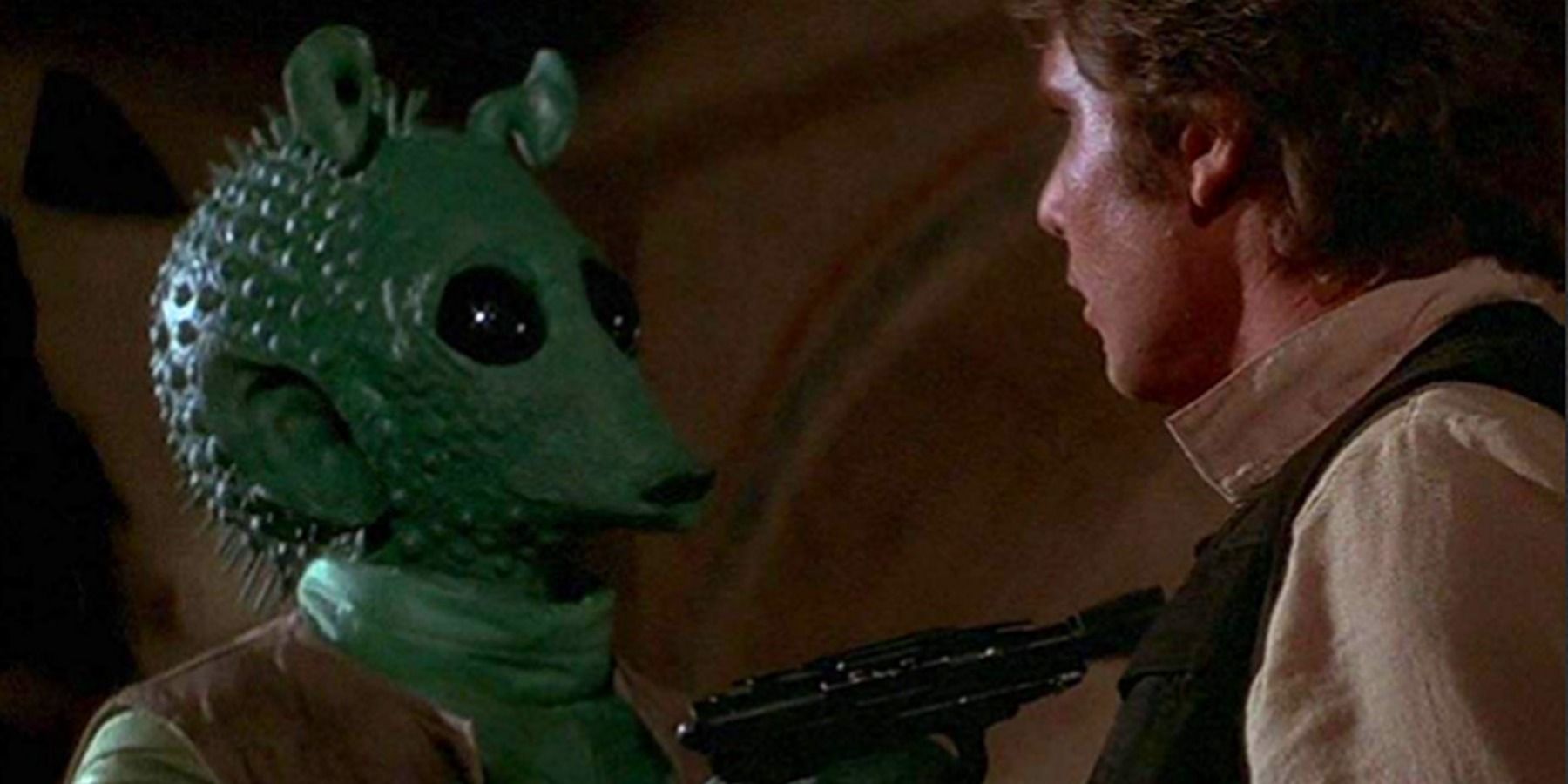 Greedo attacking Hans Solo in Star Wars