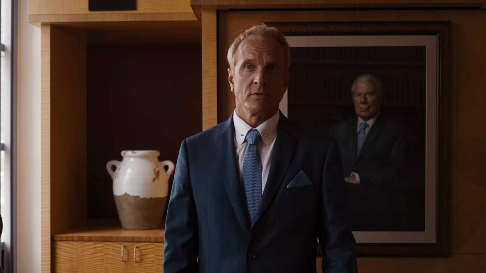 Patrick Fabian as Howard Hamlin next to Chuck portrait Better Call Saul