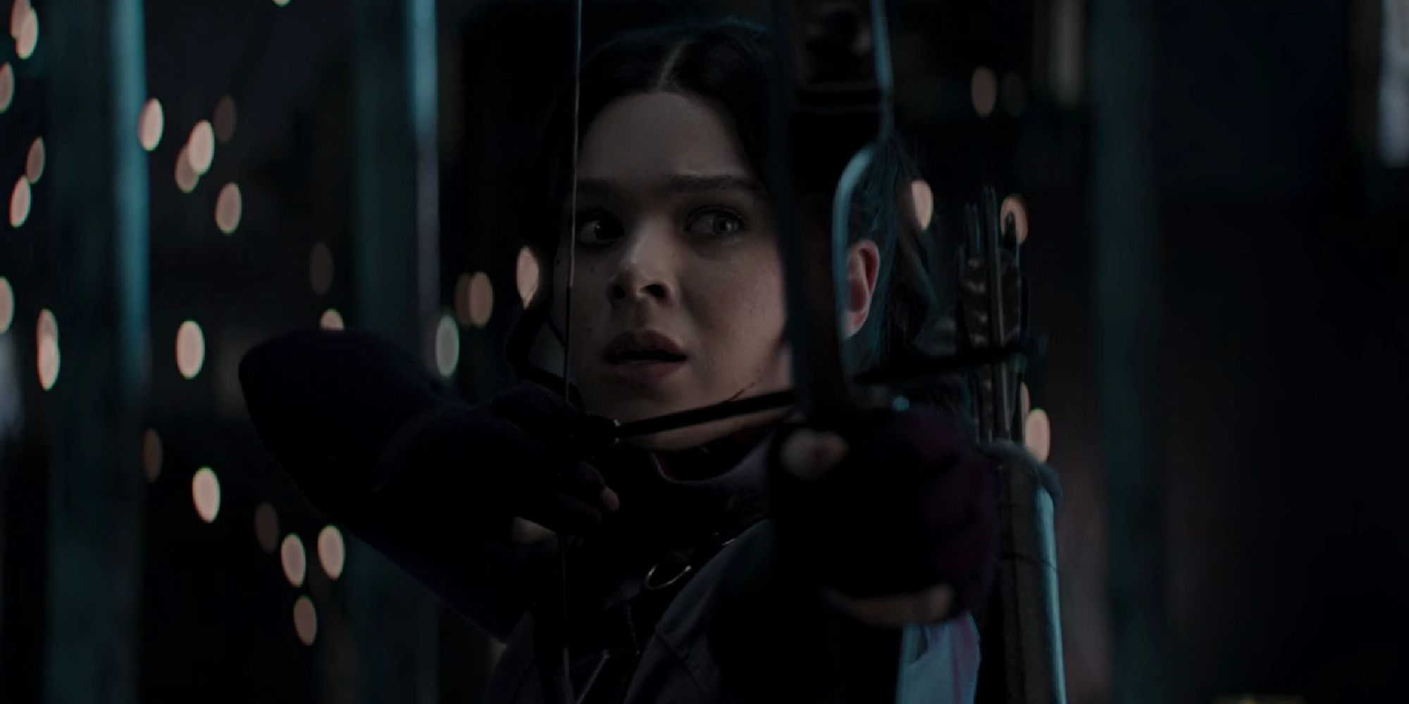 Kate Bishop looking worried as she aims her bow and arrow in Hawkeye