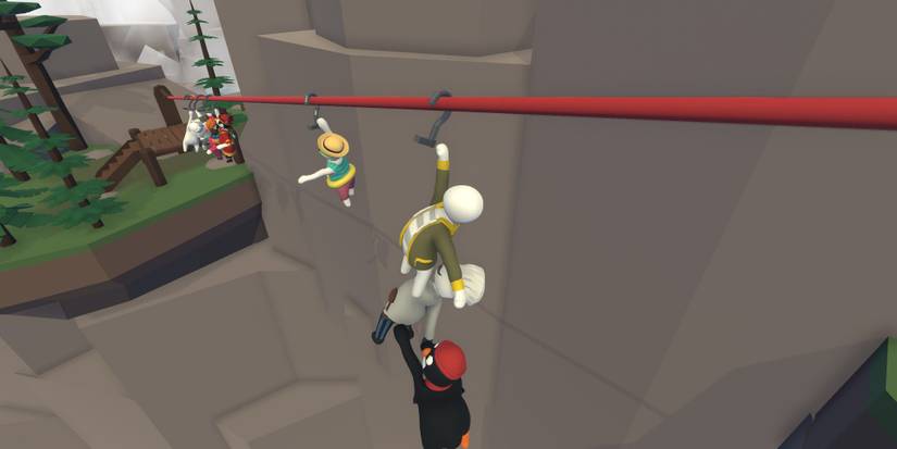 Players using a zipline in Human Fall Flat
