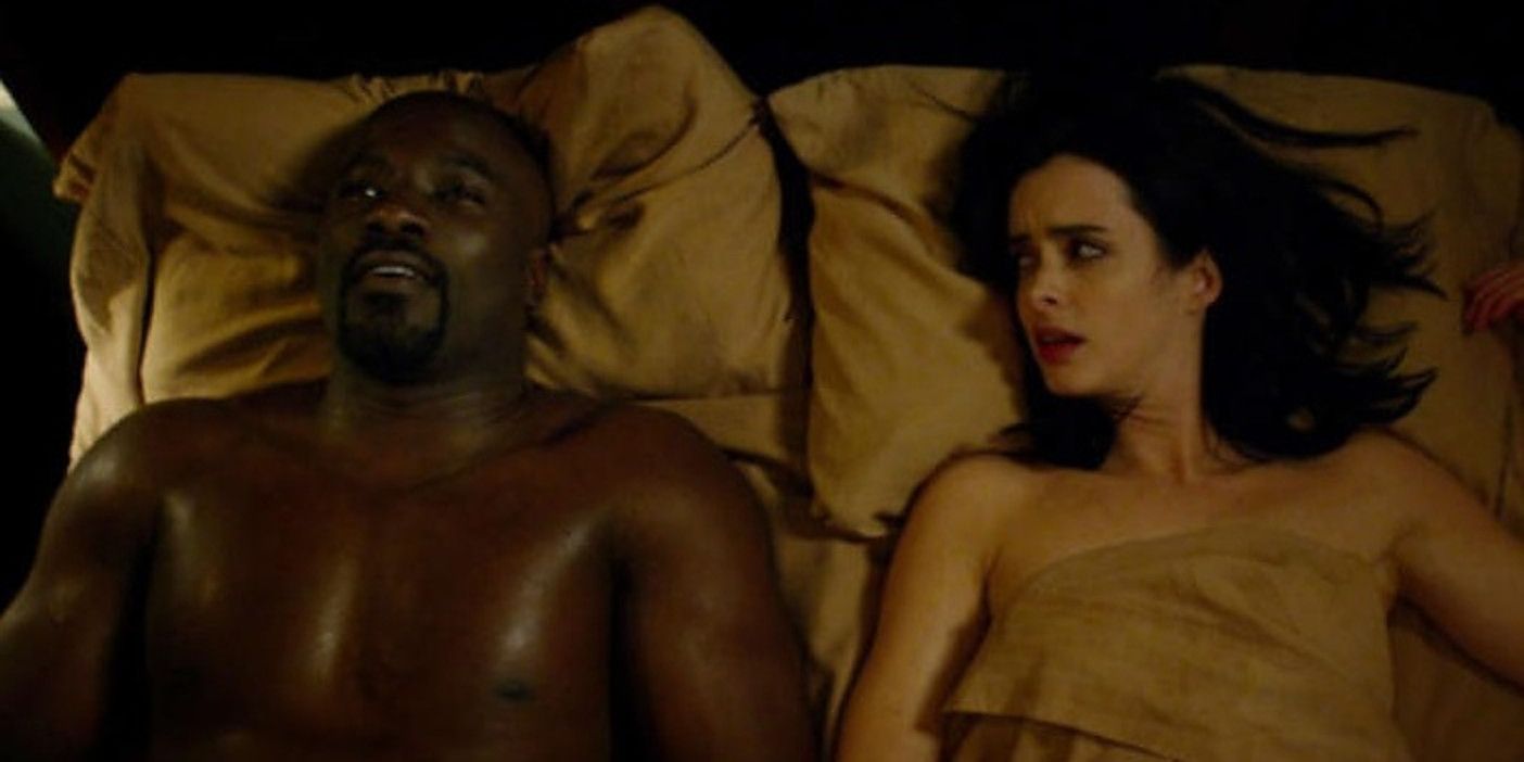 Jessica and Luke lie in bed together in Jessica Jones