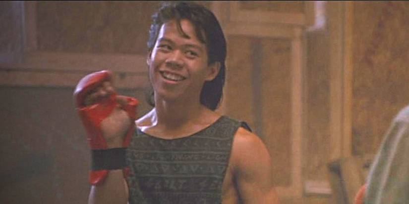 Keno, smiling and holding up a hand with a boxing glove. Image source: flickr.com