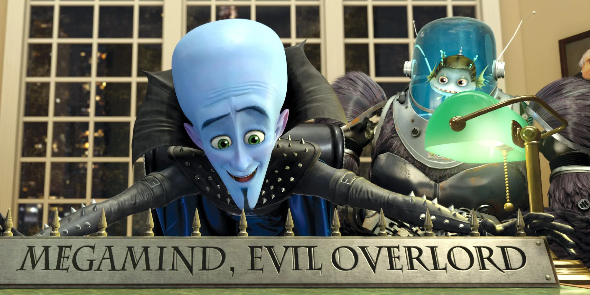 Megamind and Minion adding a desk nameplate that reads "Megamind, Evil Overlord"